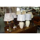 A quantity of 20th century table lamps and shades.