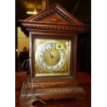 A 20th Century oak cased eight day mantel clock.