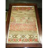 A 19th century framed and glazed needlework sampler in a mahogany frame.