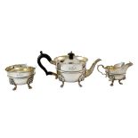 A George V three piece silver tea service, in mid 18th century Irish style,