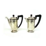 A pair of Art Deco silver cafe au lait pots, Birmingham 1935, maker's mark T.S.