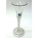 An English cordial glass, with trumpet bowl and multi-spiral stem, on a folded foot, 19cm high.