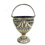 A George III circular silver sugar basket, London 1774, makers mark unclear,