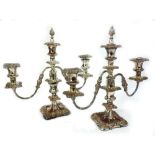 A pair of George IV style electroplate three light candelabrum, with foliate borders, 35.