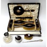 A silver and tortoiseshell mounted five piece lady's dressing set, comprising; a hand mirror,