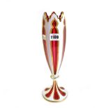 A cranberry and white enamel glass vase, late 19th/early 20th century, with gilt heightening,