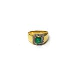 A gold, emerald and diamond set ring,