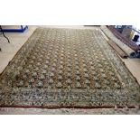 A Khorrasan carpet, Persian, with repeating triple flowerhead design, on an aubergine field,