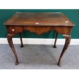 A George II style mahogany silver table, the dished rectangular top over shaped frieze,