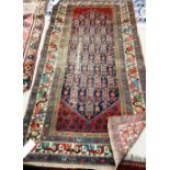 A Fereghan rug of Caucasian design, Persian, the indigo field filled with botehs,