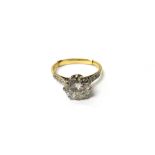 A gold and diamond set single stone ring,