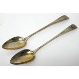 A pair of George III Scottish silver basting spoons, each crest and motto engraved Edinburgh 1809,