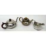 A silver small teapot, of circular form, with fluted decoration,