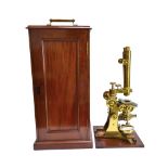 A brass binocular microscope by Edmund Wheeler, London, late 19th century,