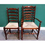 A set of ten rush seated Lancashire ladder back dining chairs on turned supports,