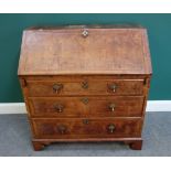 A mid-18th century feather banded figured walnut bureau,