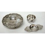 A silver twin handled tea strainer, with a silver bowl, Sheffield 1962 and a Greek circular dish,