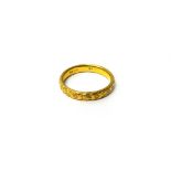 A gold wedding ring, with floral decoration, detailed 22 CT, ring size P, weight 5.5 gms.