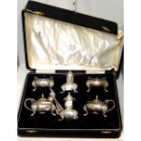 A silver six piece matched condiment set, comprising; two mustard pots, London 1937 and 1939,