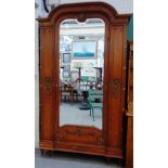 An Empire style king wood and fruitwood armoire,