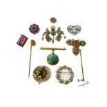 A gold, amethyst and seed pearl set shaped circular brooch, a colourless paste set brooch,