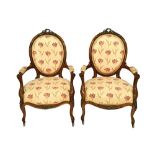 A pair of mid 19th century gilt metal mounted walnut armchairs,