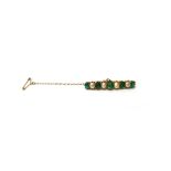 A gold, emerald and cultured pearl brooch, mounted with a row of five cushion shaped emeralds,