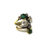 Two gold rings and one other ring, mounted with two larger colourless gems,