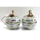 A pair of modern decalcomania glass table lamps, each of spherical form decorated with fish,