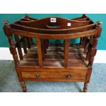 A Regency mahogany Canterbury, the concave top over four sections and single drawer,