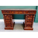 A small Victorian mahogany pedestal desk, with nine drawers flanked by split barleytwist supports,