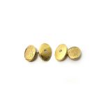 A pair of gold and diamond set cufflinks, with oval backs and fronts,