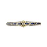 A diamond, sapphire and seed pearl brooch, in a tapered elliptical design,