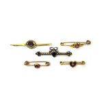 A gold, amethyst and seed pearl set bar brooch, detailed 15 CT,