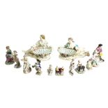 A pair of Meissen style porcelain figural sweetmeat baskets, 20th century,