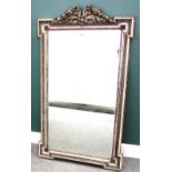 A 19th century silver painted mirror, with outstepped square corners and floral carved upper frieze,