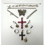 A foil backed pink gem set pendant cross, a faceted steel finial from a lady's hair ornament,