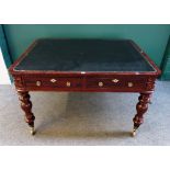 A mid 19th century mahogany writing table the rounded rectangular top over a pair of frieze drawers
