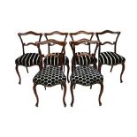 A set of six mid-19th century rosewood framed dining chairs,