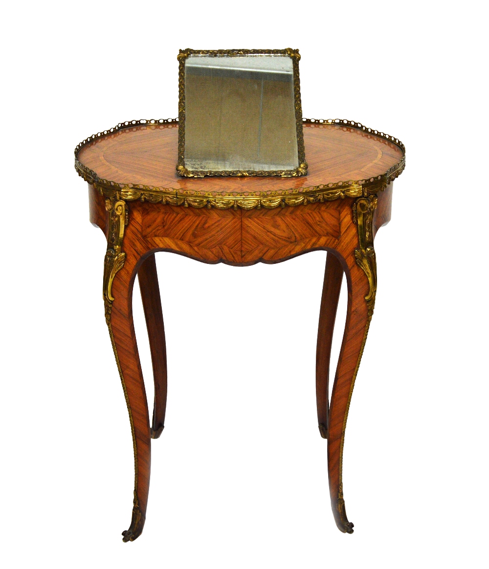 A mid 19th century French gilt metal mounted tulipwood Poudreuse/ dressing table,