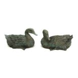 A pair of late 20th century verdigris patinated metal ducks, 32cm wide (2).