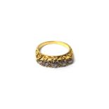 A gold and diamond set five stone ring,