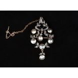 A rose diamond and blister pearl set pendant brooch, in a wreath and bow design,