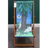 A modern deckchair printed with a design after Fleur Cowles of a Tiger by a tree - the original