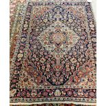 A Sarough rug, Persian, the black field with an ivory and madder medallion, matching spandrels,