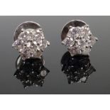 A pair of diamond set seven stone cluster earstuds, each in a hexagonal design,