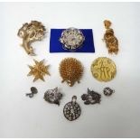 A gold filigree brooch, designed as a Maltese cross, a Trifari costume brooch, designed as a spray,