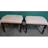 A pair of mahogany rectangular footstools, with serpentine short ends, on turned tapering supports,