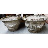 A set of four composition stone planters,