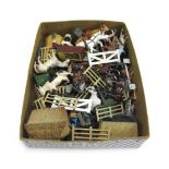 A quantity of Britains hollow cast lead animals and accessories from the Farmyard range (qty).